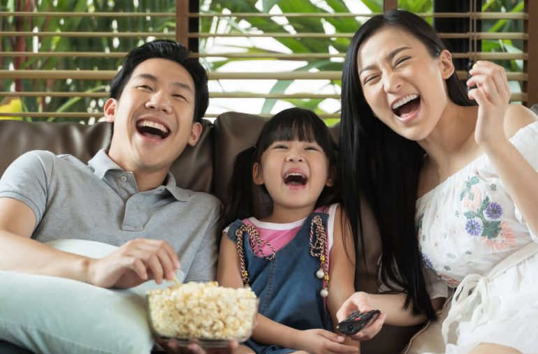 A family watching movie for Father's Day