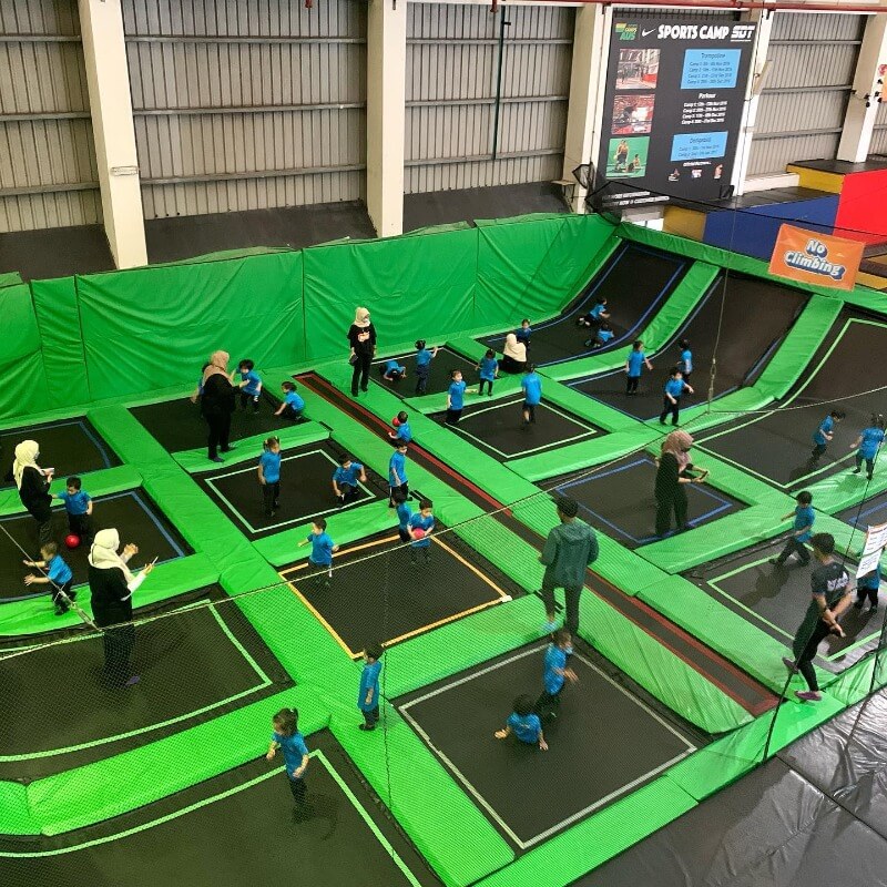 large green and black trampoline with many segments for father's day