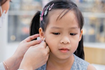 A girl getting ear piercing