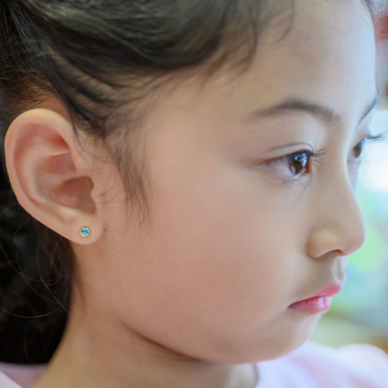 A girl wearing an earring