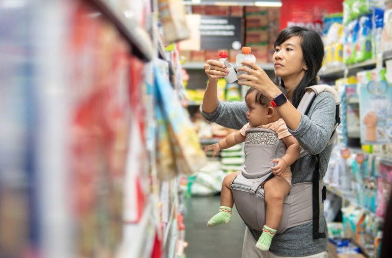 A mom spending for her baby at a store