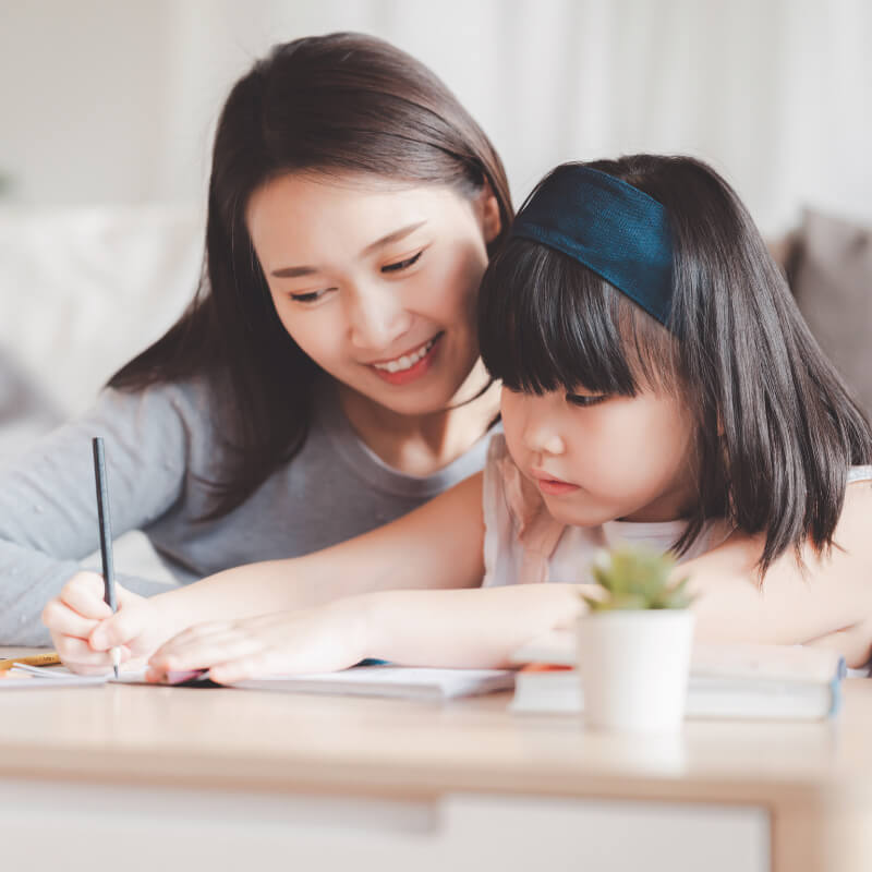 A mum teaching her daughter