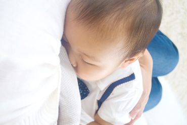 A toddler on extended breastfeeding