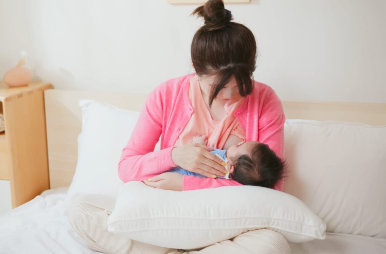 A mum breastfeeding her baby