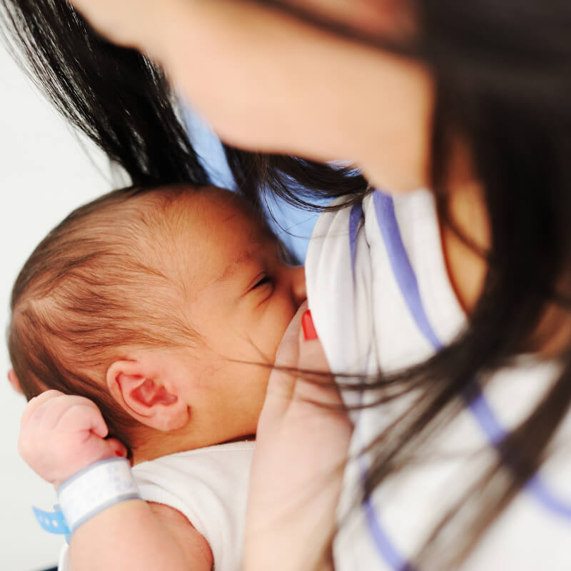 A mum breastfeeding her newborn