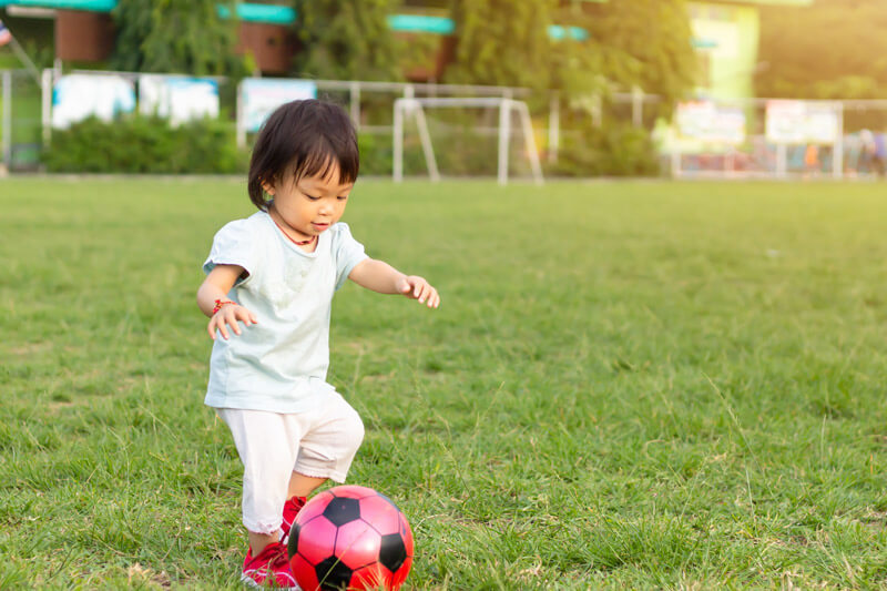 26-month-old developmental milestones girl playing with ball