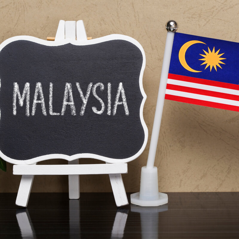 Malaysia sign and flag on table