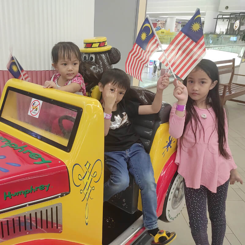 My kids posing at the mall for National Day