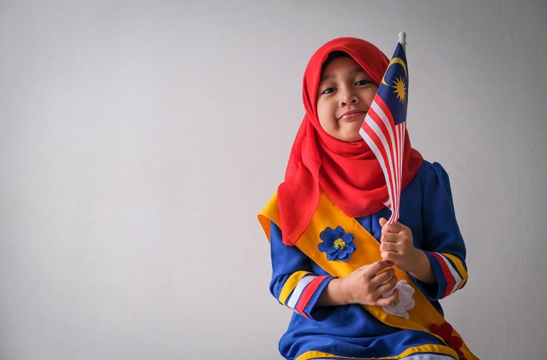 toddler wearing a Malaysian flag-themed t-shirt