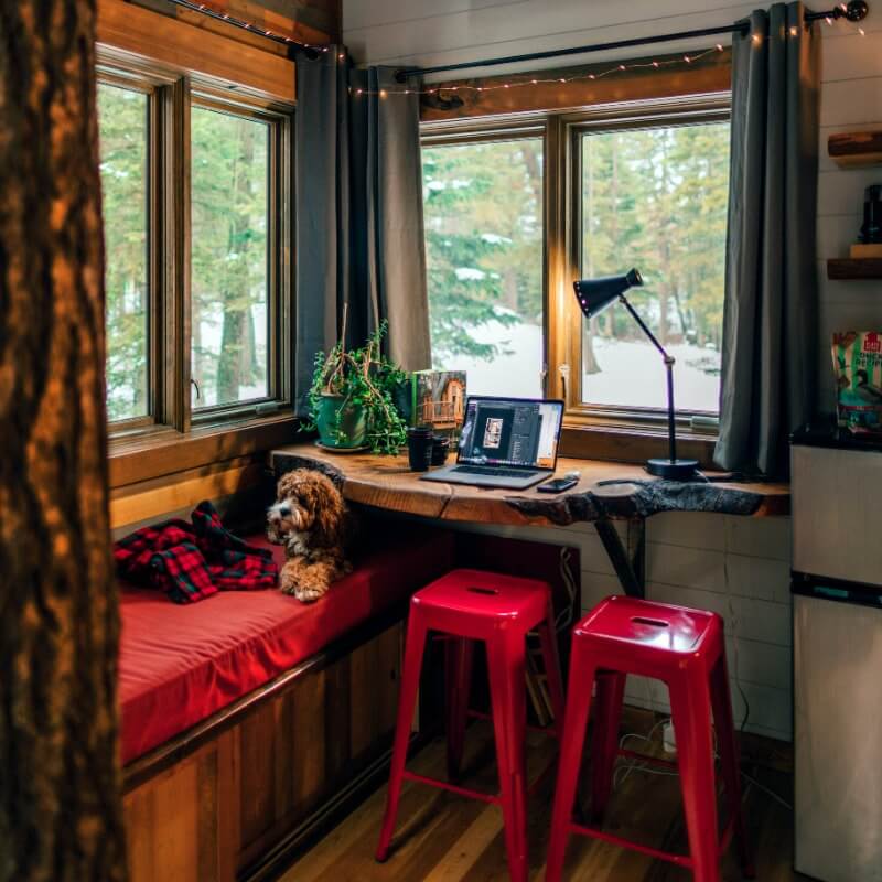 cozy workspace in red with large windows