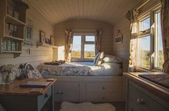 small bedroom with wooden walls