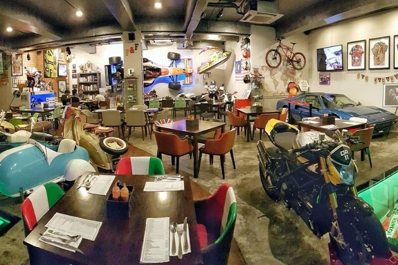 decorative vehicles in colourful restaurant interior Kuching
