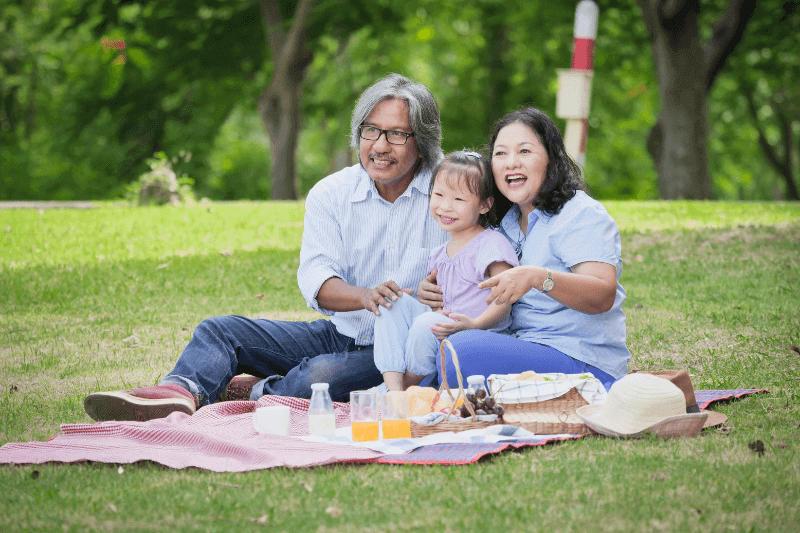 Grandparents on a picnic with their grandchild
