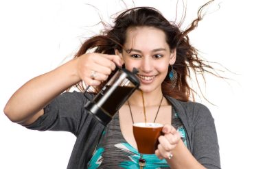 A lady addicted to caffeine pouring coffee