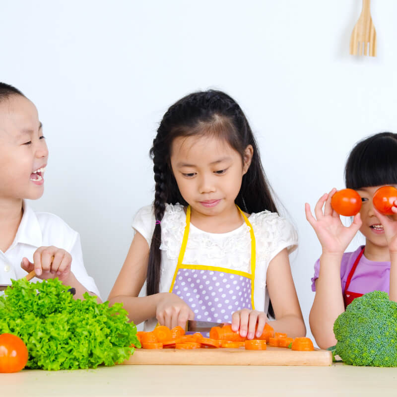 Kids with variety of vegetables