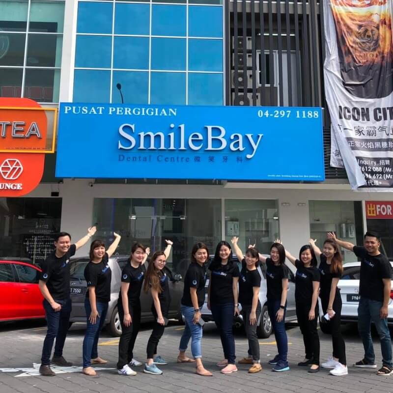 line of people standing in front of SmileBay
