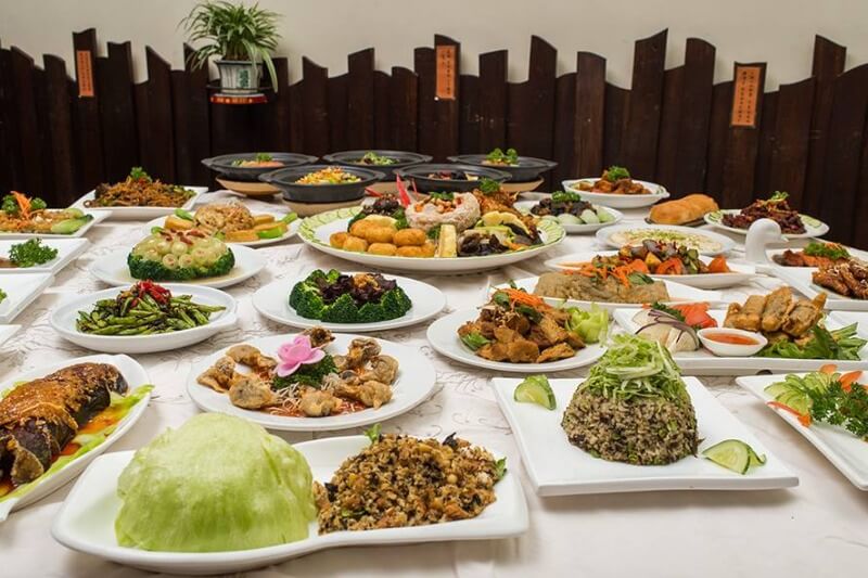 table white table cloth with various vegetarian dishes