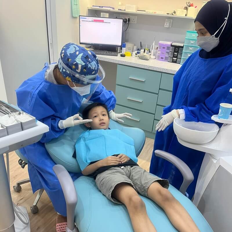 little boy in dental chair