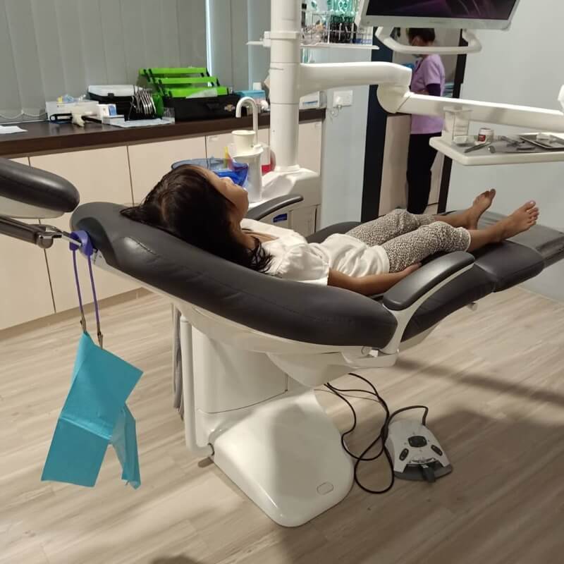 child on dentist chair - dental clinic Kuching