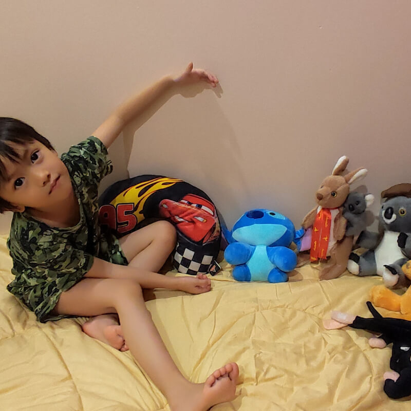A boy tidying up