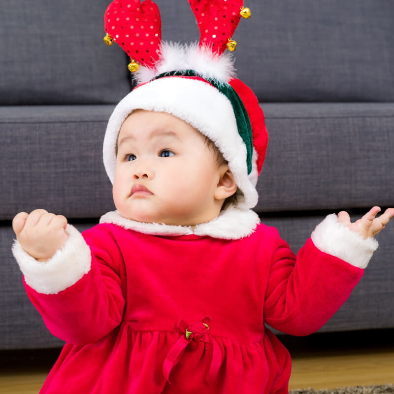 A cute baby in Christmas dress