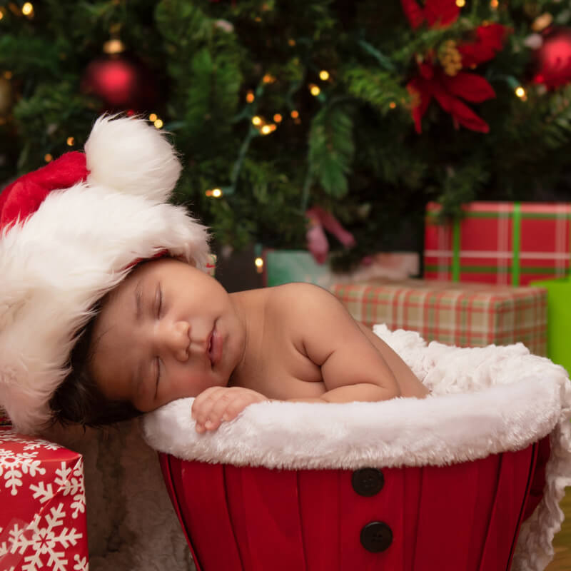 Baby near a Christmas tree