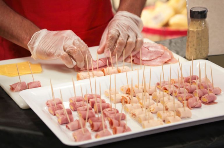 A cook preparing food