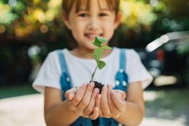 A girl learning to garden