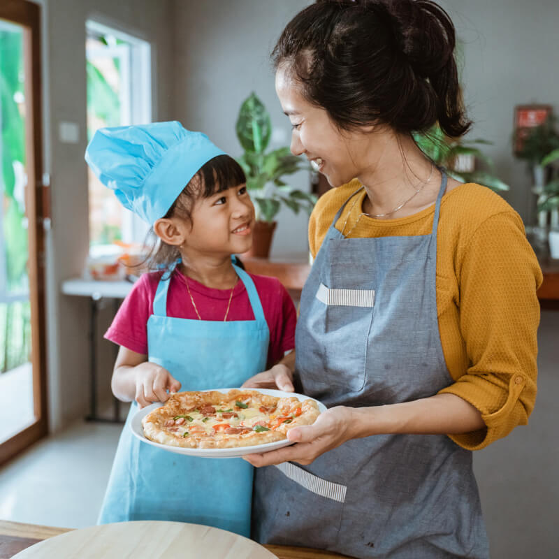 A mum cooking with her daughter