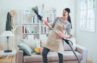 A mum having fun while cleaning