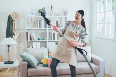 A mum having fun while cleaning