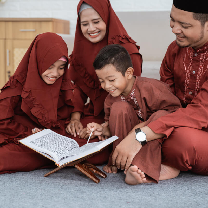 a family reading the Quran