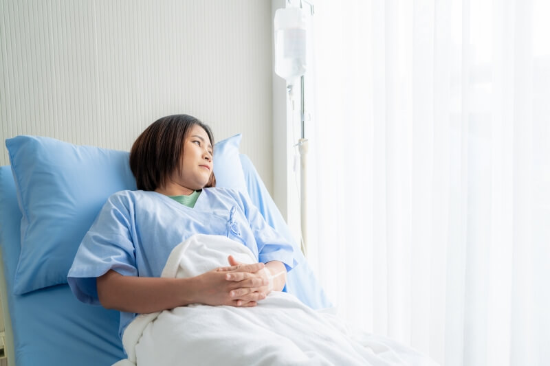 woman at hospital bed