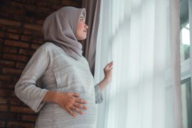 a pregnant mum thinking about fasting