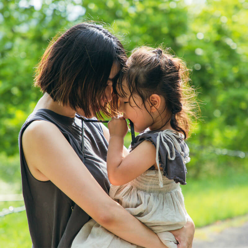 A mum consoling her whining daughter