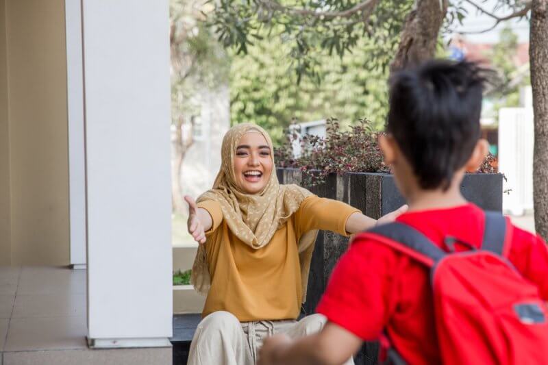 mother opening arms to son life lessons