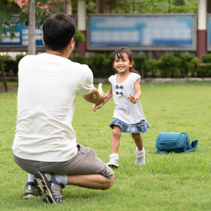 a girl running to her dad