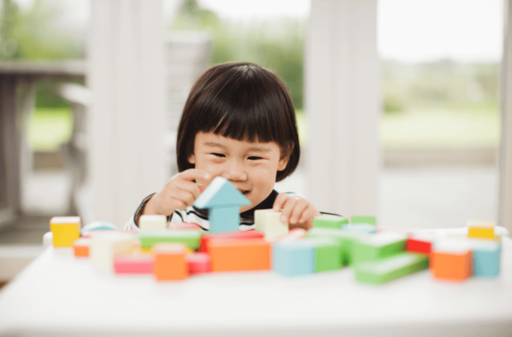 child playing with blocks