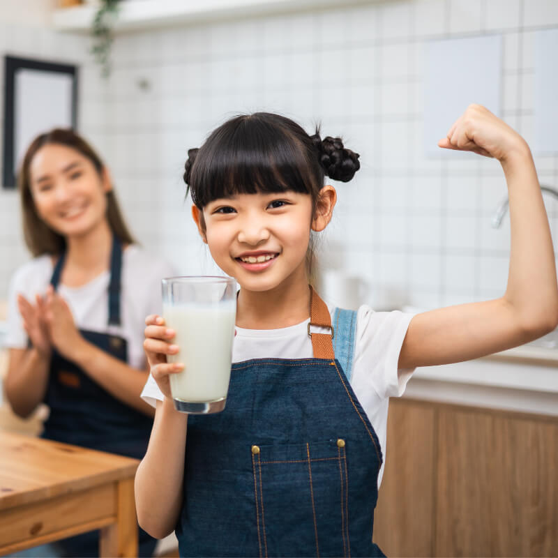 a girl strong drinking milk