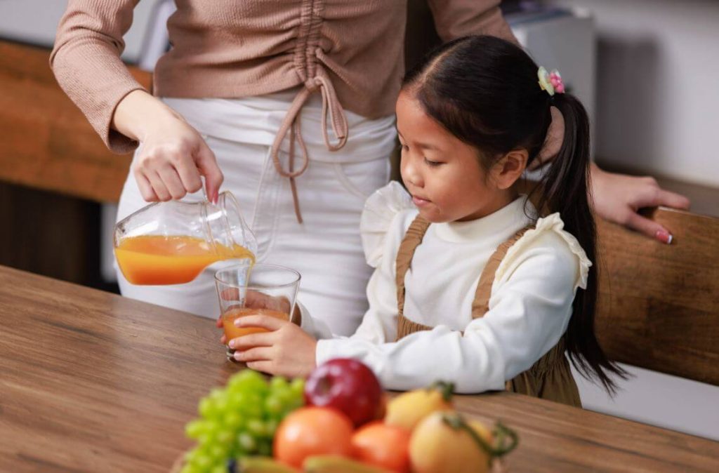 toddler drinking juice