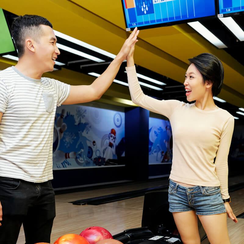 couple playing bowling