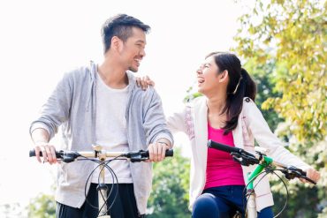 couple cycling caring for health