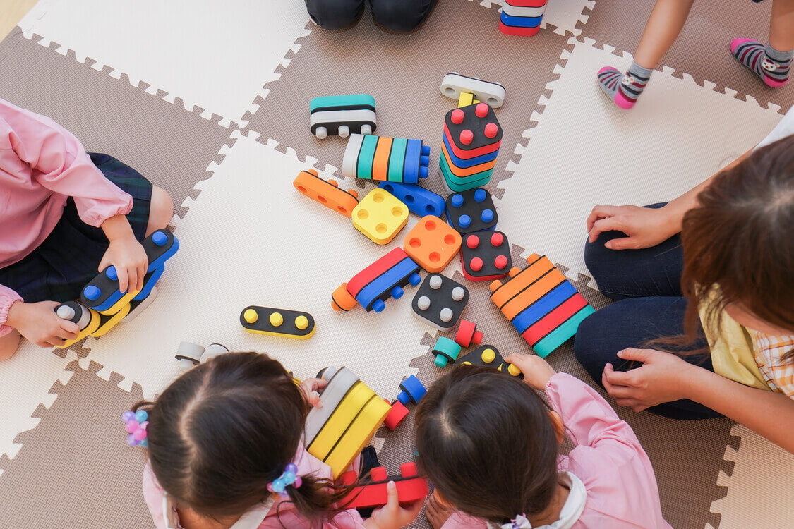 children at childcare center playing with toys