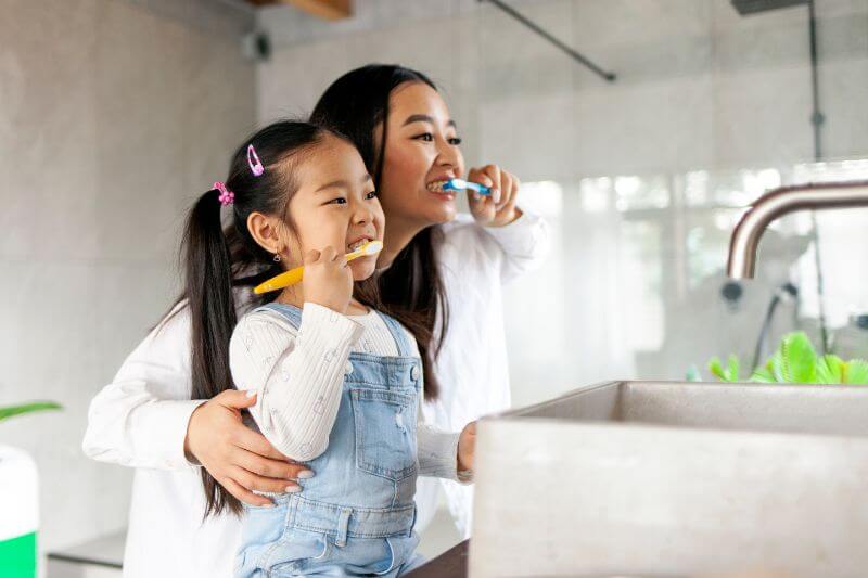 mum-daughter-brushing-teeth