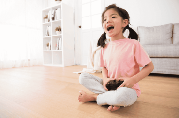 Girl Playing Online Game with Controller