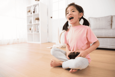 Girl Playing Online Game with Controller