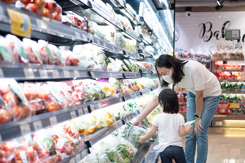 mum and child grocery shopping