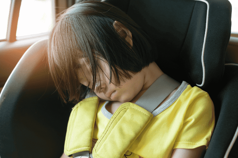 girl sleeping in car seat fbs