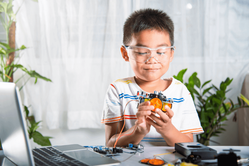  boy assembling smart toy