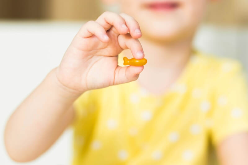 immune boosters child holding a child supplement